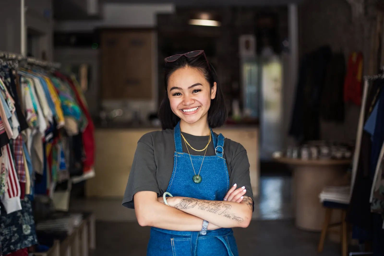 A store owner standing proudly in her shop